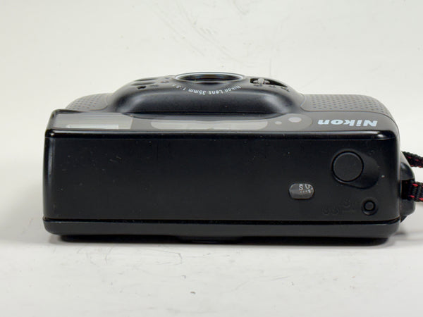 Top view of Nikon Sport Touch 35mm film camera showing zoom lens and control buttons. Compact point and shoot ideal for students and vintage camera lovers.