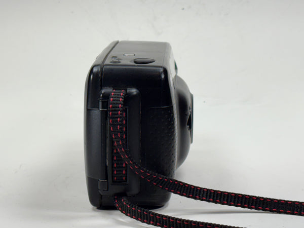 Side view of Nikon Sport Touch Point and Shoot 35mm film camera with wrist strap, a compact 35mm film camera ideal for students and vintage camera collectors.