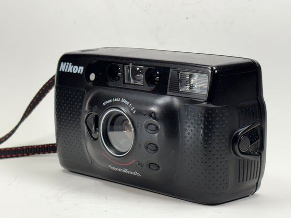 Nikon Sport Touch 35mm film camera with fixed 35mm f/3.5 lens and built-in flash, ideal for students and vintage photography lovers.