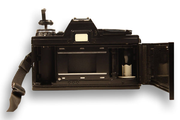 Open film compartment of Minolta X-370S, revealing the film loading mechanism. A must-have for analog photography lovers.