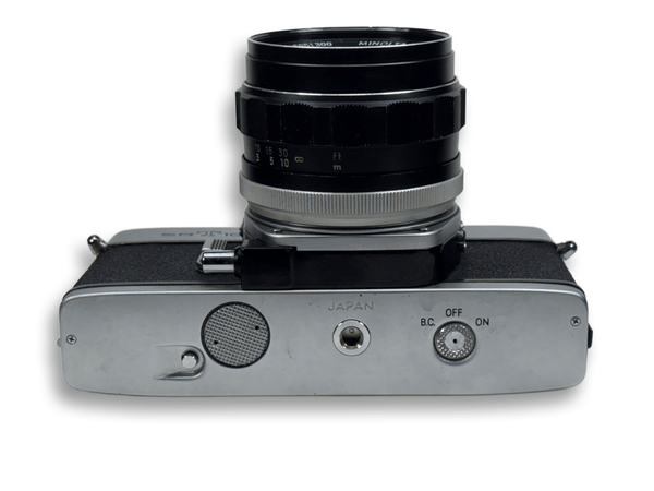 Vintage camera with lens on a white background