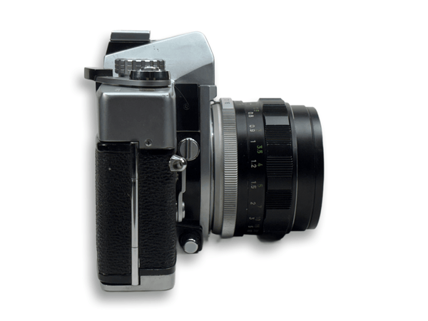 Vintage camera with a prominent lens on a white background